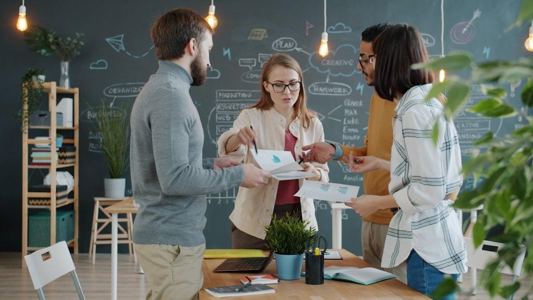 Founder pitching to a small team in a modern Singapore startup office