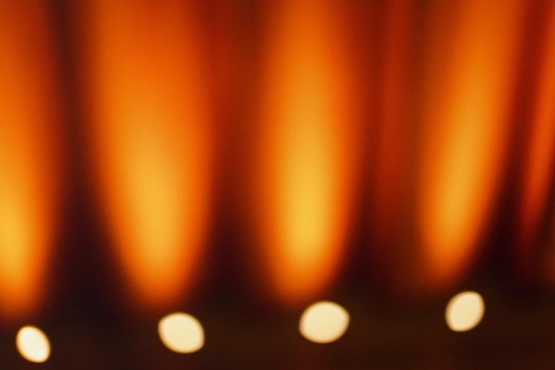 Performing artist on stage under warm theatre lights